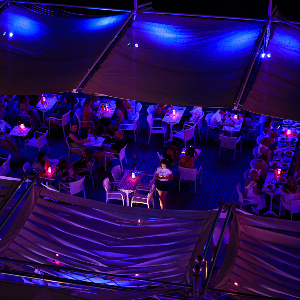 The bustling terrace of Café del Mar at night